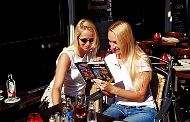 Two tourists planning sightseeing trip, Amsterdam, The Netherlands (Holland), Europe