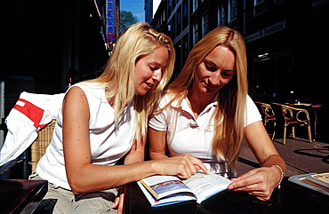 Two tourists planning sightseeing trip, Amsterdam, The Netherlands (Holland), Europe