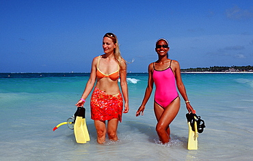 Two female skin divers on the beach, Punta Cana, Dominican Republic, West Indies, Caribbean, Central America