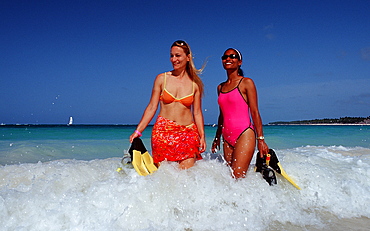 Two female skin divers on the beach, Punta Cana, Dominican Republic, West Indies, Caribbean, Central America