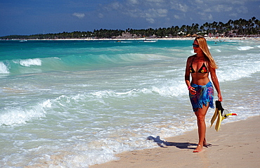 Woman walking on sandy beach, Catalina Island, Dominican Republic, West Indies, Caribbean, Central America