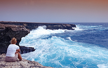 Woman and stormy coast, Netherlands Antilles, Bonaire, Caribbean Sea, Washington Slagbaai National Park, Suplad?