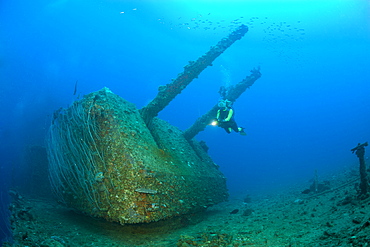 Diver and Twin 8-inch 55 caliber Gun on USS Saratoga, Marshall Islands, Bikini Atoll, Micronesia, Pacific Ocean