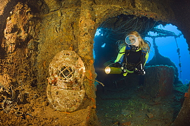 Diver discover Diving Helmet on Brigde of USS Saratoga, Marshall Islands, Bikini Atoll, Micronesia, Pacific Ocean