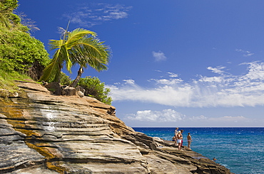 Tourists at Chinawall Rocks at Kawaihoa Point, Oahu, Pacific Ocean, Hawaii, USA