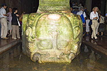 Tourists at Medusa in Yerebatan Sarayi Cistern, Istanbul, Turkey