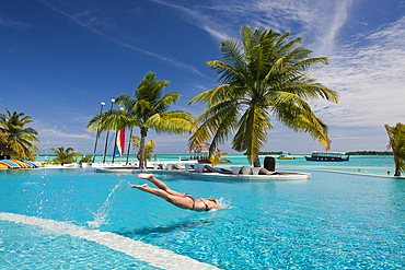 Tourist in Pool of Maldive Island Kandooma, South Male Atoll, Maldives