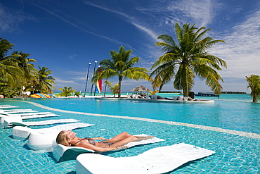 Tourist in Pool of Maldive Island Kandooma, South Male Atoll, Maldives