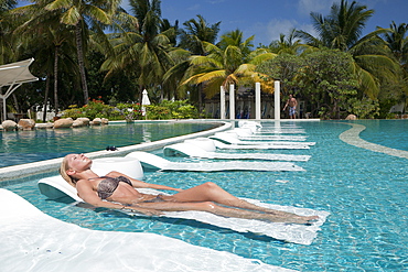 Tourist in Pool of Maldive Island Kandooma, South Male Atoll, Maldives