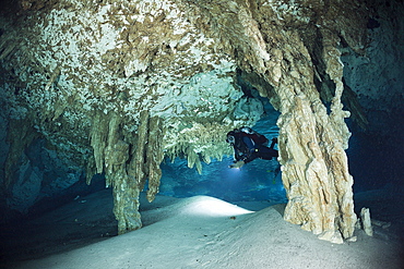 Scuba diver at Dos Ojos Cenote, Playa del Carmen, Yucatan Peninsula, Mexico