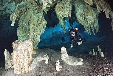 Scuba diver at Dos Ojos Cenote, Playa del Carmen, Yucatan Peninsula, Mexico