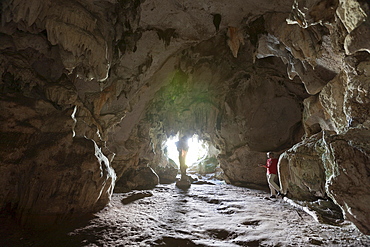 Tourist inside San Gabriel Limestone Cave, Los Haitises National Park, Dominican Republic, West Indies, Central America