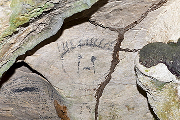 Pre-Columbian Rock paintings inside La Linea Limestone Cave, Los Haitises National Park, Dominican Republic, West Indies, Central America