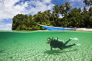 Scuba diver in Lagoon of Ahe Island, Cenderawasih Bay, West Papua, Indonesia, Southeast Asia, Asia