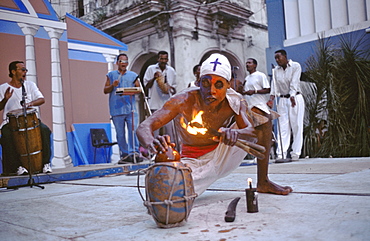 A dancer uses fire to invoke Chango, an African deity of fire, at a festival of Afro-Cuban Culture in Guanabacoa, Cuba