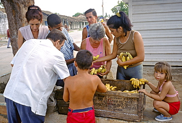 Buying bananas at a street market in town of Casilda near Trinidad in Sancti Espiritus Province in central Cuba, Cuba