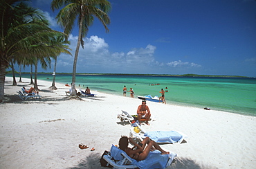 Sunbathers and tourists on beach near resorts, Playa los Cocos, Santa Lucia, Camaguey Province, Cuba