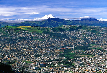 Ecuador's capital and second largest city a view of Quito with Cotopaxi, at 5900 meters, 19,350ft the world's highest active volcano, Quito, Ecuador