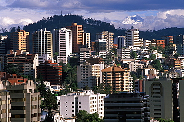 Ecuador's capital and second largest city a view of Quito with Cotopaxi, at 5900 meters, 19,350ft the world's highest active volcano, Quito, Ecuador