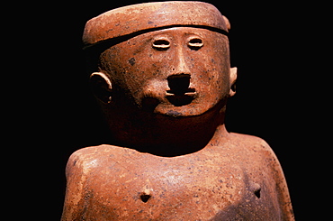 Capuli Culture a ceramic 'Coquero' funerary figure chewing coca, from the collection of the Banco Central de Ecuador, Quito, Ecuador