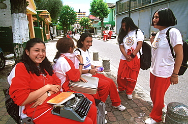 Ecuador's capital and second largest city students going to Manuela Canizares Girls School for typing classes in New Town area, Quito, Ecuador