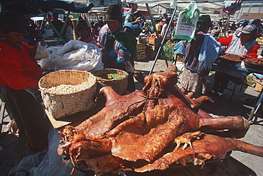 Saquisili south of Quito is one of Latin America's most important indigenous markets vendor selling pork and chicharron, Quito, Ecuador