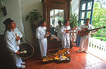 Hacienda Pinsaqui historic hacienda now hotel in highlands north of Otavalo, musicians with traditional charango, queno, guitar and drum, Highlands North of Quito, Ecuador