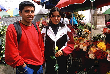 Cuenca World Heritage City & Ecuador's third largest city, famous for its colonial architecture students in flower market off Calderon Park, Highlands, Ecuador