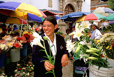 Cuenca World Heritage City & Ecuador's third largest city, famous for its colonial architecture student in flower market off Calderon Park, Highlands, Ecuador