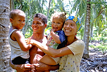 Family of cocoteros, workers on a coconut plantation in the rural town of Barigua east of Baracoa in eastern Cuba, Cuba