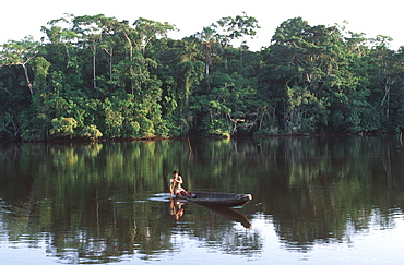 Amazon River Basin Napo River (Amazon tributary) down river from Coca indian in dugout canoe in primary, uncut jungle rainforest, Oriente, Ecuador