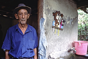 Portrait of a campesino in the doorway of his home near the town of Baracoa in eastern Cuba, Cuba