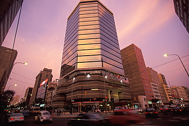 Main intersection of busy upscale suburb of Lima with highrise banks, shops and apartments, Lima, Peru