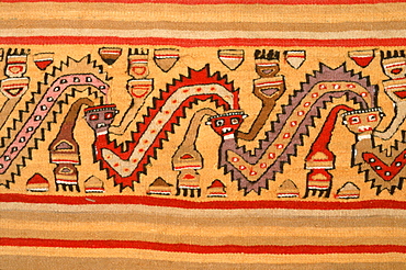 Chancay Culture, 13C AD serpents with human heads on a fragment of a mantle in the collection of the Museo Amano, Lima, Peru