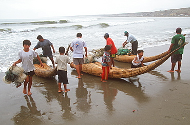 Caballitos de totora', small fishing boats woven of totora reeds in a style unchanged since pre-Inca times at Huanchaco beach, Trujillo, North Coast, Peru