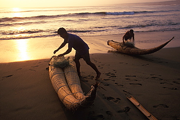 Caballitos de totora', small fishing boats woven of totora reeds in a style unchanged since pre-Inca times at Huanchaco beach, Trujillo, North Coast, Peru