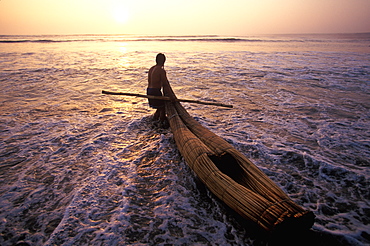 Caballitos de totora', small fishing boats woven of totora reeds in a style unchanged since pre-Inca times at Huanchaco beach, Trujillo, North Coast, Peru