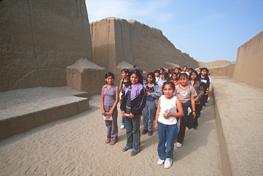 Chimu Culture Chan Chan, 1300-1468AD, capital of empire and world's largest adobe city covering 20 sqkm near Trujillo students in Palacio Tschuldi, Peru