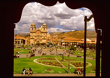 Ancient capital of the Incas the Plaza de Armas in the colonial center of the city with the baroque La Compania Church, c1571, Cuzco, Highlands, Peru