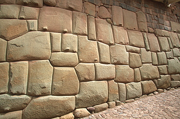 Cuzco off Calle Hatunrumiyoc is a section of fine Inca stonework with pieces fitted together to represent a Puma, the head is center/left, Cuzco, Highlands, Peru