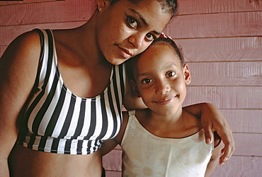 Portrait of two sisters in their home in the rural town of La Serafina in the southern area of Havana Province, Cuba