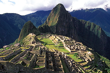 Machu Picchu view of the ancient city with Huayna Picchu Peak above the Rio Urubamba in the Vilcabamba Mountains, Highlands, Peru