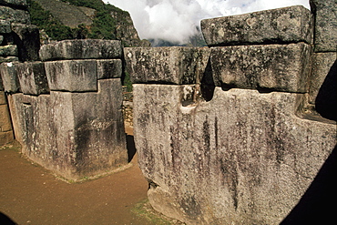 Machu Picchu the Sacristy, a small room off the Principal Temple in the Sacred Area, is reknown for a large stone cut with 32 corners, Highlands, Peru