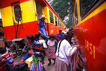 Machu Picchu the train from Cuzco arrives in Aguas Calientes the town and railroad station below site passengers unloading supplies, Highlands, Peru