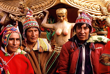 Corpus Christi Festival in Cuzco men carrying a santo in procession around the Plaza de Armas, Peru