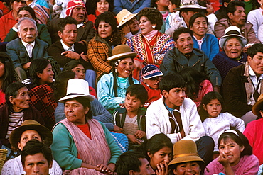 Corpus Christi Festival in Cuzco spectators sitting on the steps below the Cathedral watching the procession in the Plaza de Armas, Peru