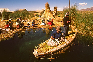 Floating islands of the Uros near Puno an ancient culture, noted for making traditional boats of woven totora reeds, Lake Titicaca, Peru