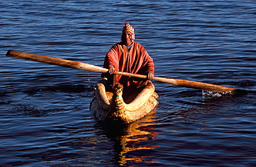 Floating islands of the Uros near Puno an ancient culture, noted for making traditional boats of woven totora reeds, Lake Titicaca, Peru