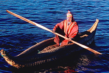 Floating islands of the Uros near Puno an ancient culture, noted for making traditional boats of woven totora reeds, Lake Titicaca, Peru