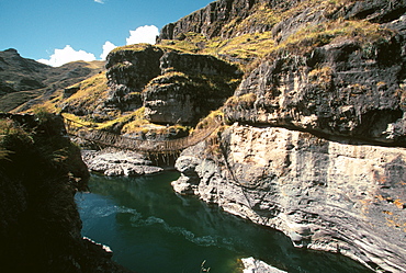 Famous Incan grass-rope suspension bridge across Apurimac River rebuilt annually since Incan period and only one still in existence, Inca Road, Altiplano, Peru